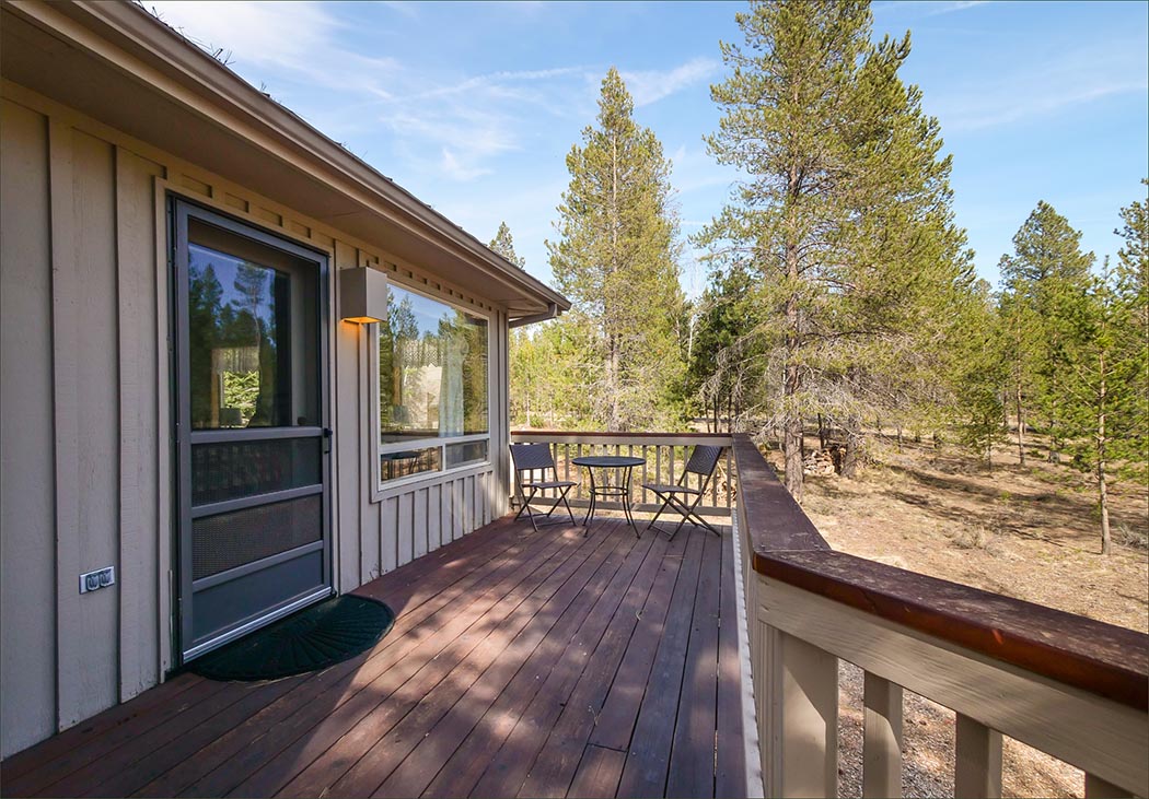 Master bedroom upper deck access with personal table and chairs.