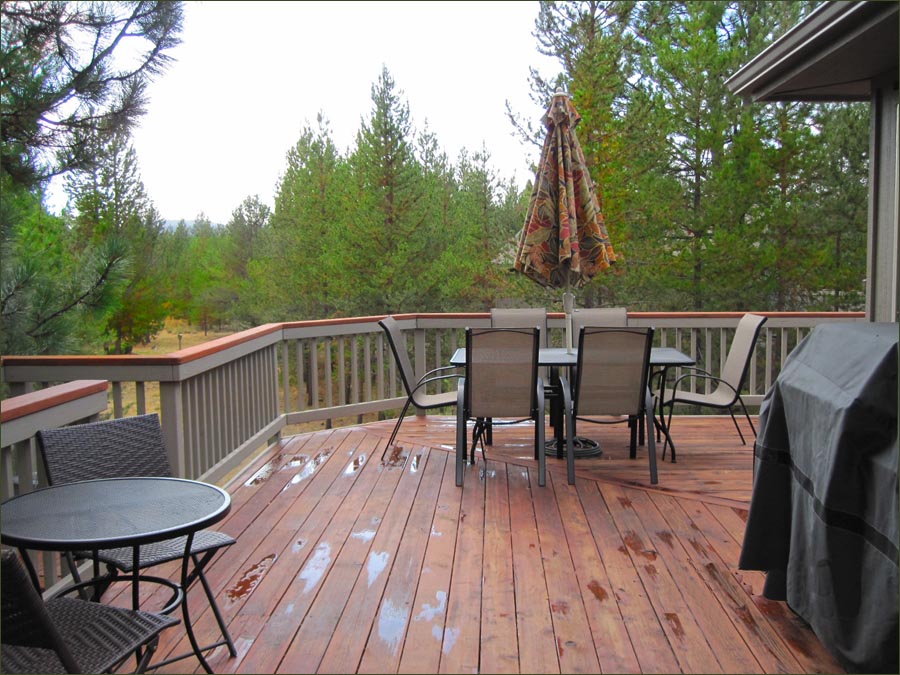 Sunriver rental large deck with gas barbecue grill, dining and lounge furnishings.