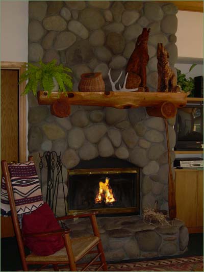 Warm great room, roaring fireplace family gathering together following a grand day out playing in the snow!