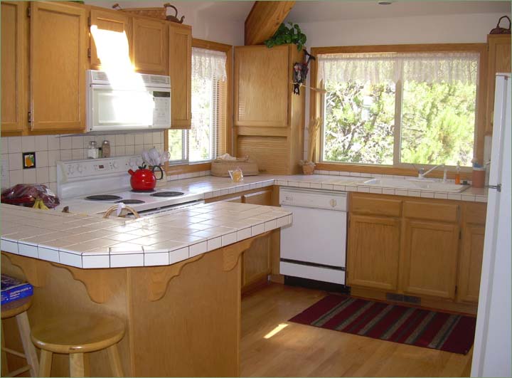 Large family kitchen fully equipped with modern appliances and cookware