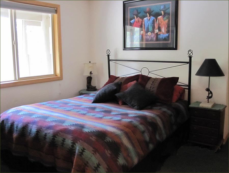 Mt Bachelor master bedroom with king sized bed; ideal family ski home.