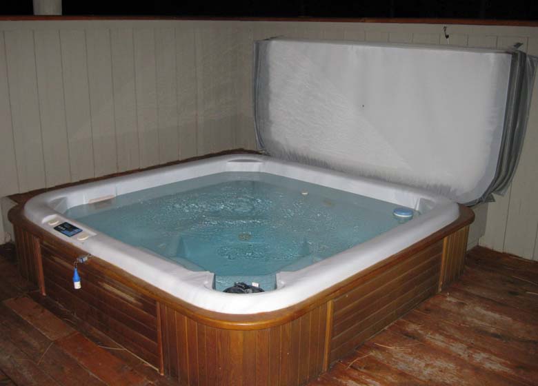 Huge private hot tub for guests to enjoy at the Haven Sunriver vacation rental.