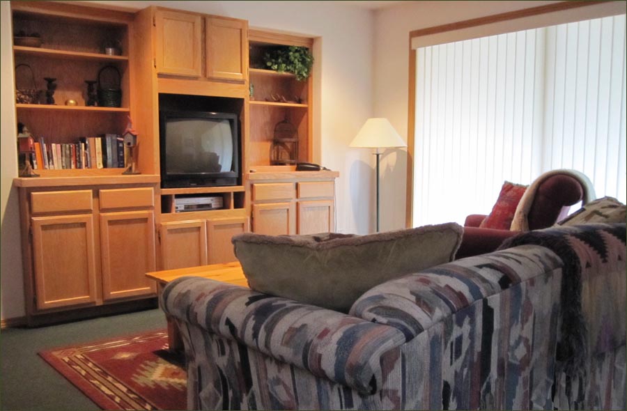 The family room is great for TV and kids. Here, you'll find a hide-away bed and the doorway leading to the deck with a large, bubbling HOT TUB...awaiting tired muscles! 